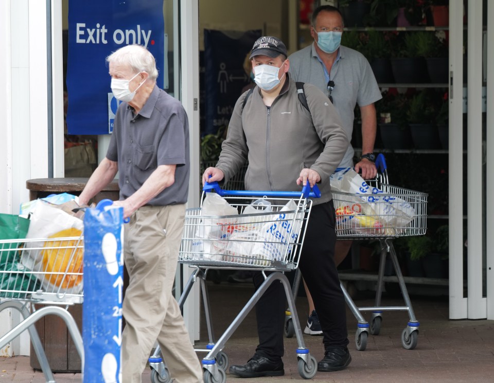 People wearing masks whilst shopping at Tesco in West London