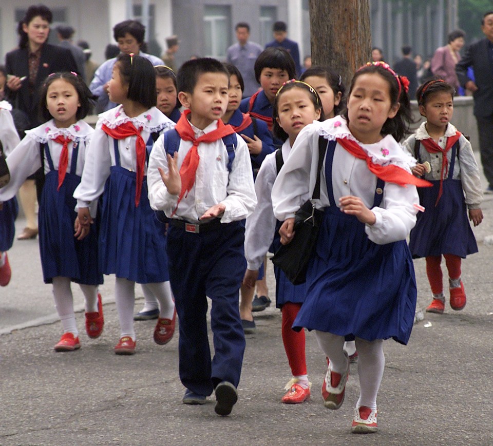 North Korean children heading to school in 2001 - Jihyun worked in a school before she defected