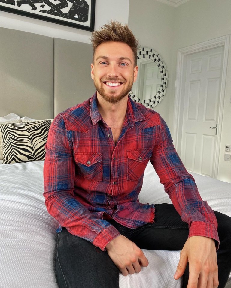 Sam, 28, poses in front of a modern circular mirror in the pair’s minimalistic bedroom