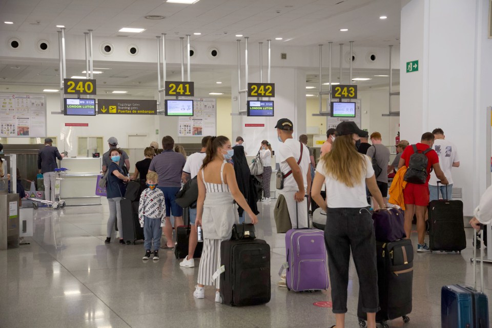 Brits at the check-in desk at Malaga Airport the morning after new quarantine rules came in