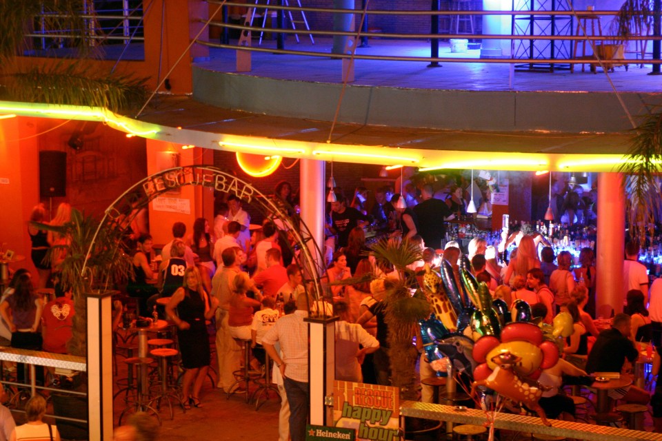 The town’s bars and restaurants aren’t as busy as during a typical summer (pictured), but they are still attracting a decent number of visitors