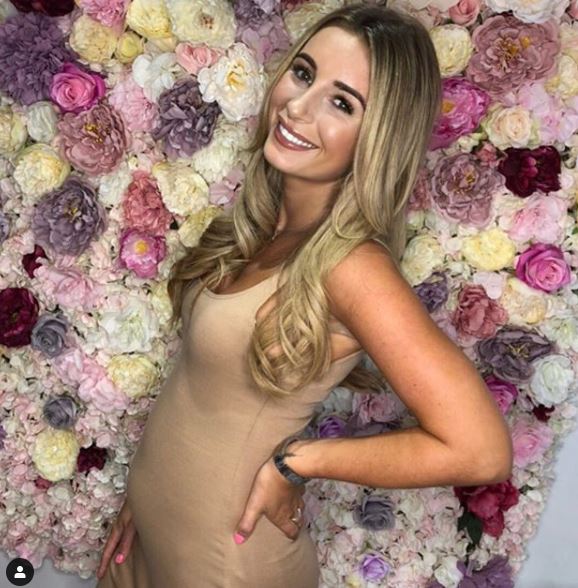 Dani has revealed her baby bump