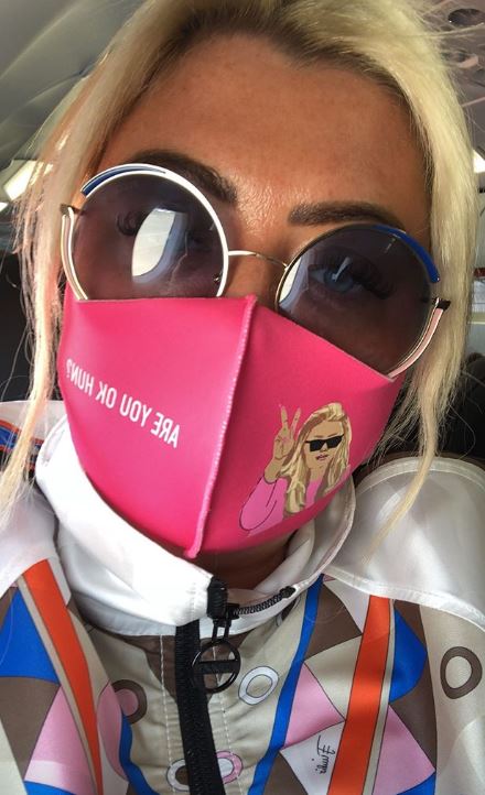 And wore a personalised face mask on the plane