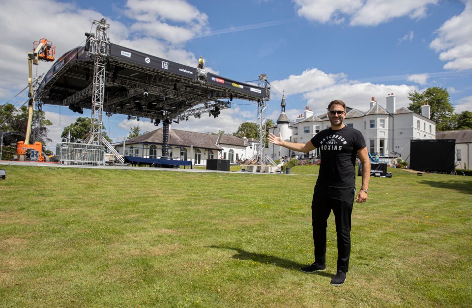 Eddie Hearn proudly posed in front of the ring after it began to be put up