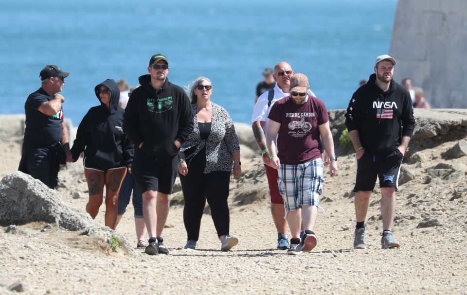 Charlotte, second from left, and her partner Bruce Charles, left, join Harry's dad Tim Dunn, third from right, and his wife Tracey Dunn, centre, ahead of the service