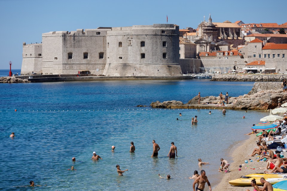 People are seen at Banje beach in Dubrovnik, Croatia