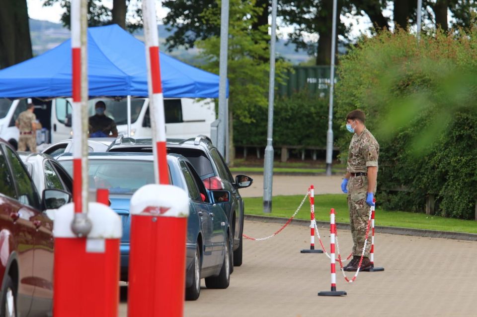 Queues of cars formed at a mobile coronavirus testing centre in Blackburn