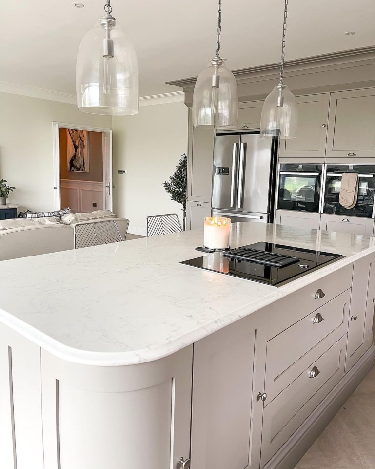  It boasts cream work surfaces and matching cupboards