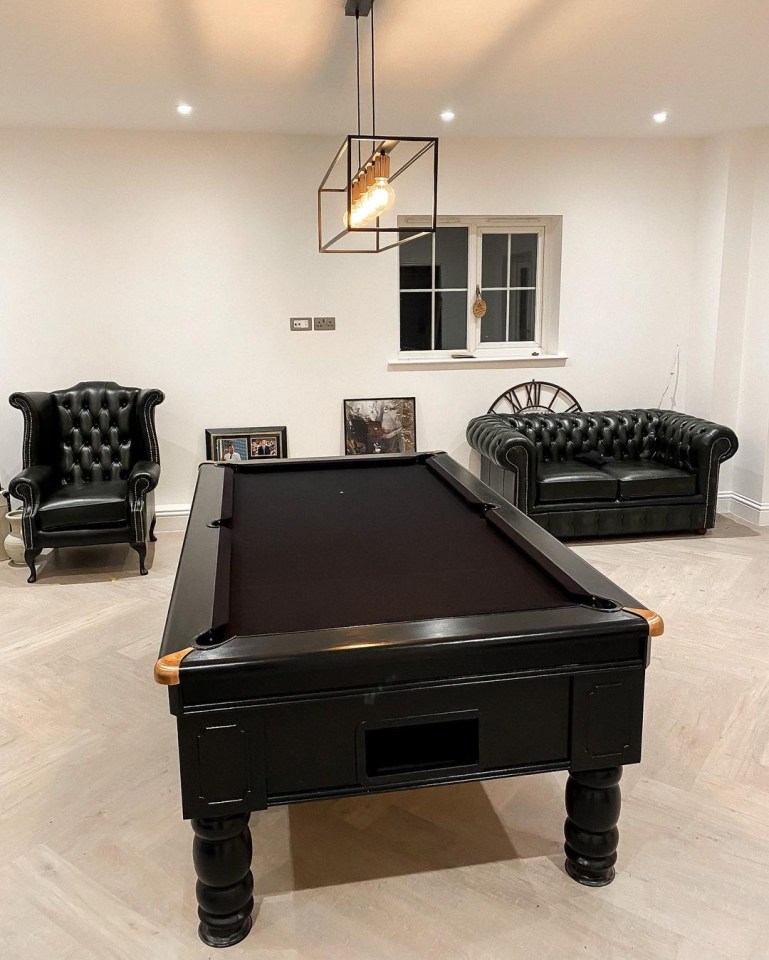  There is a games room with a black snooker table