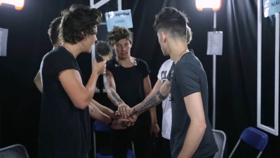 The boys get ready for a concert backstage