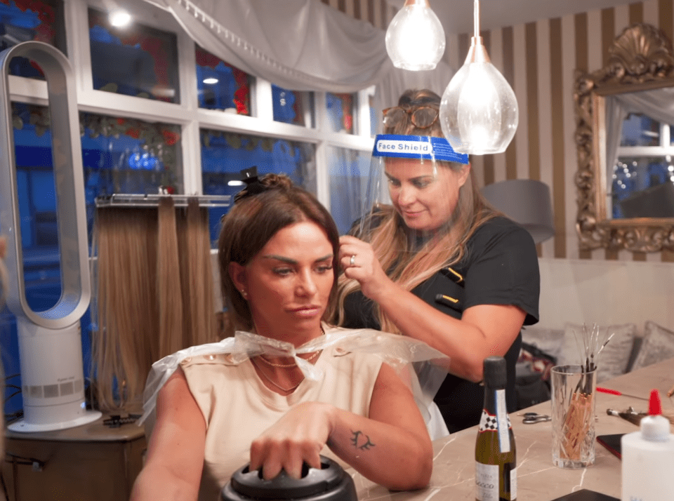 Katie's hairdresser wore protective PPE clothing during their 11-hour appointment