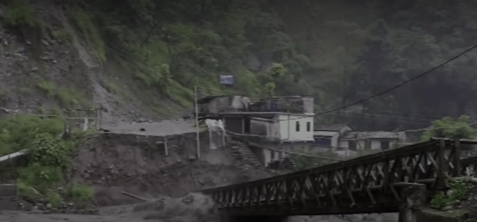 Torrents were filmed smashing through bridges