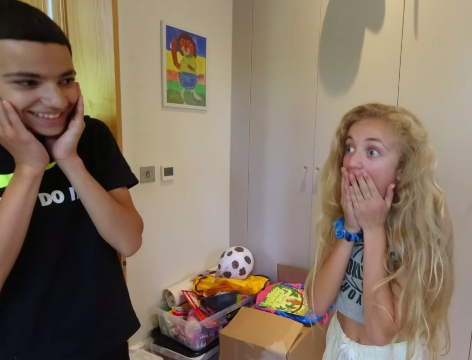 She screamed with delight at the surprise - while brother Junior covered his ears