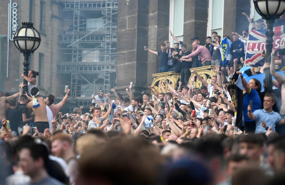 Leeds United fans celebrated after winning the Sky Bet Championship title at Millennium Square