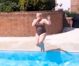 Gemma pinched her nose as she jumped into the water