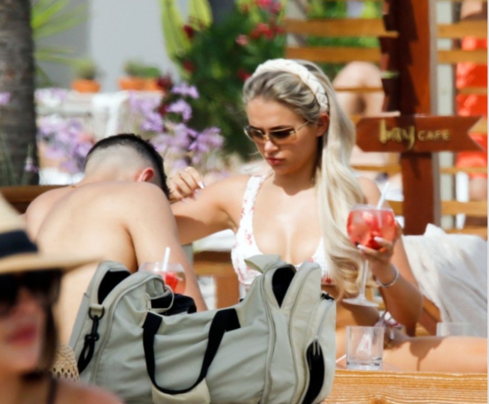 Tommy and Molly-Mae cool down with a cocktail at the bar