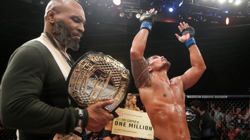 Boxing legend Tyson holds onto a PFL season championship belt 