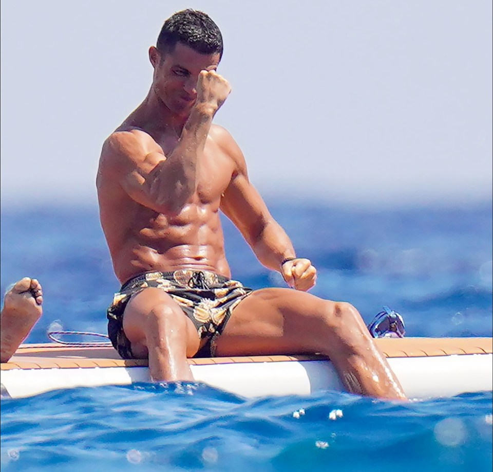 Cristiano Ronaldo flexed for his pals as he splashed his feet in the ocean