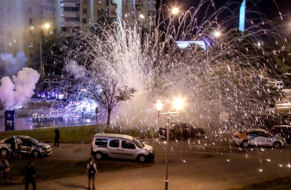 Stun grenades explode as protesters take to the streets in Minsk