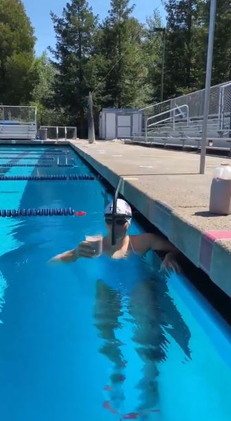 US champion swimmer Katie Ledecky swam a full swimming pool length with a glass of milk on her head