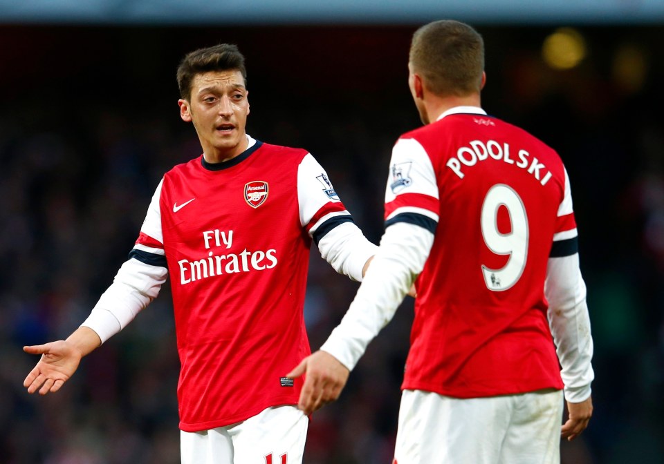 Ozil (left) played in Mikel Arteta's first ten games in charge of Arsenal before dropping down the pecking order at the Emirates