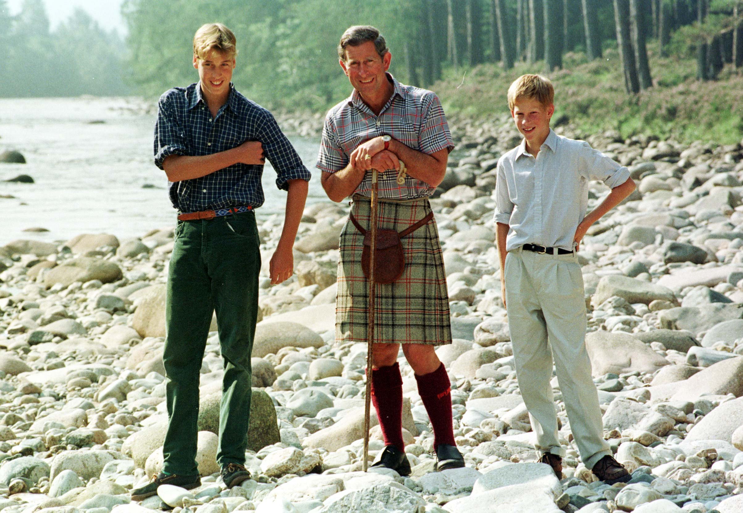 Prince Charles with Harry and William by the River Dee near the castle