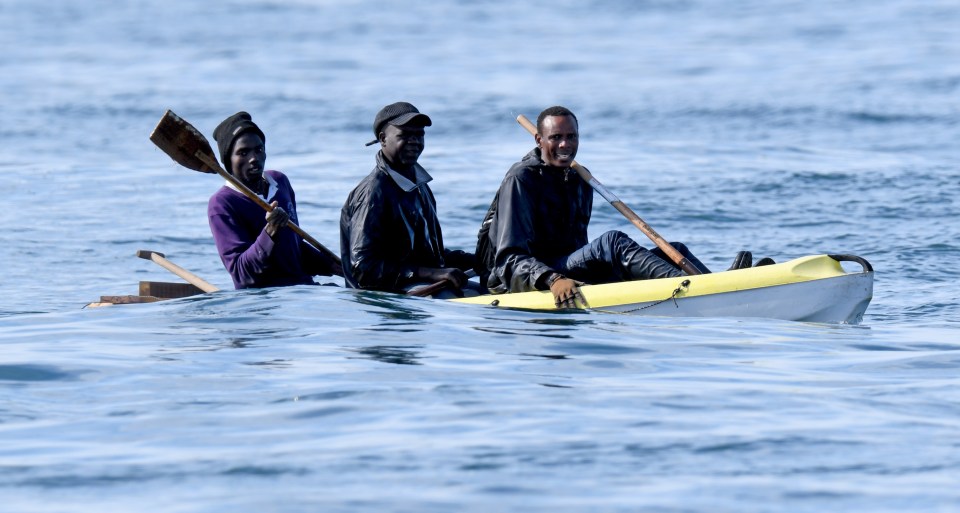 Migrants reaching Britain in a dinghy with shovels as oars 