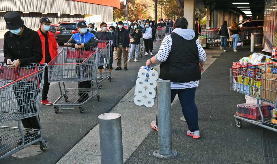 Large queues are seen outside supermarkets inside the infection zone