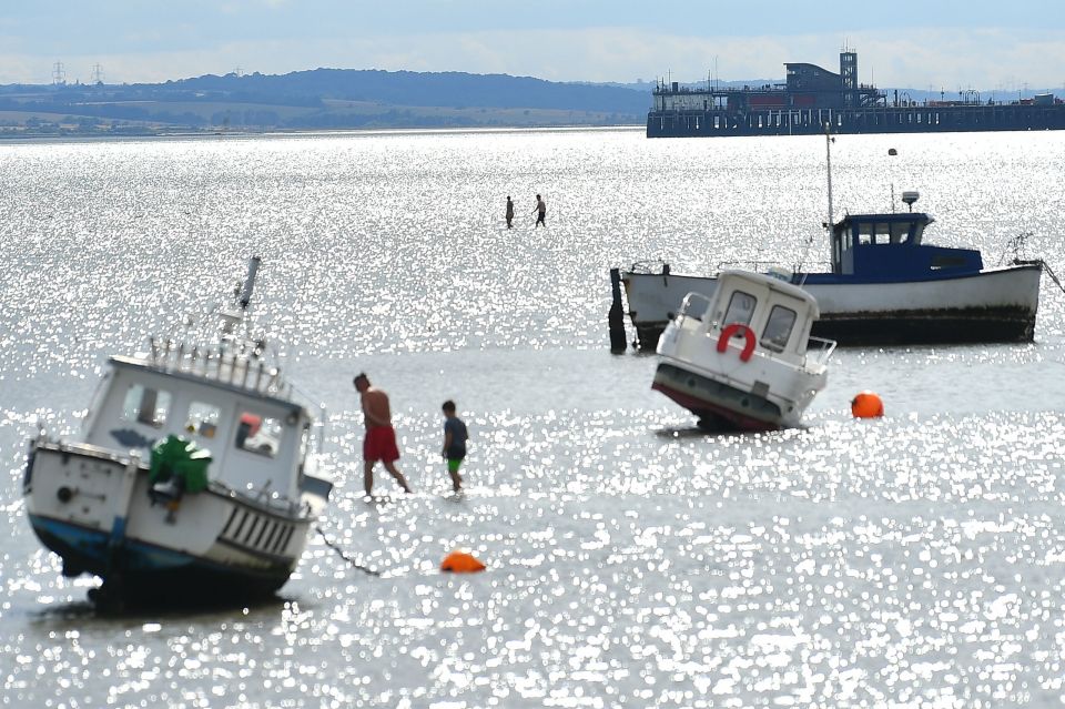 Beach goers enjoy the heat in Southend, Essex