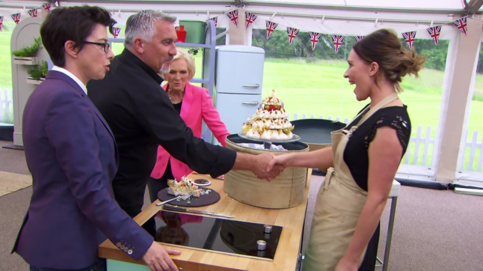 Candice Brown shakes hands with Paul after the success of her meringue