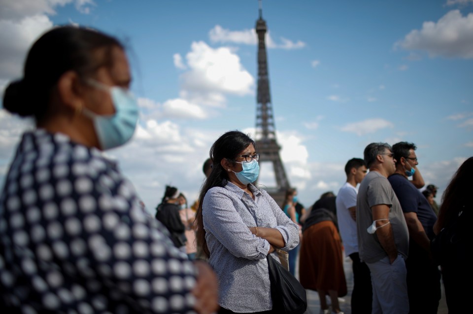 Masks were worn as people walked in Trocadero square near the Eiffel Tower