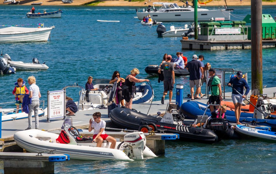 People enjoy the water at Salcombe in Devon