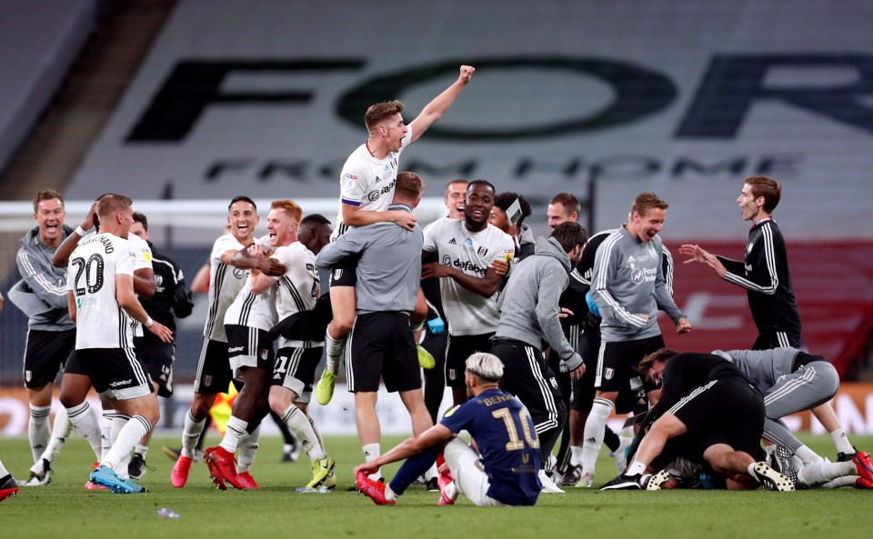 Skipper Tom Cairney is hoisted in the air as Fulham celebrate at the full-time whistle