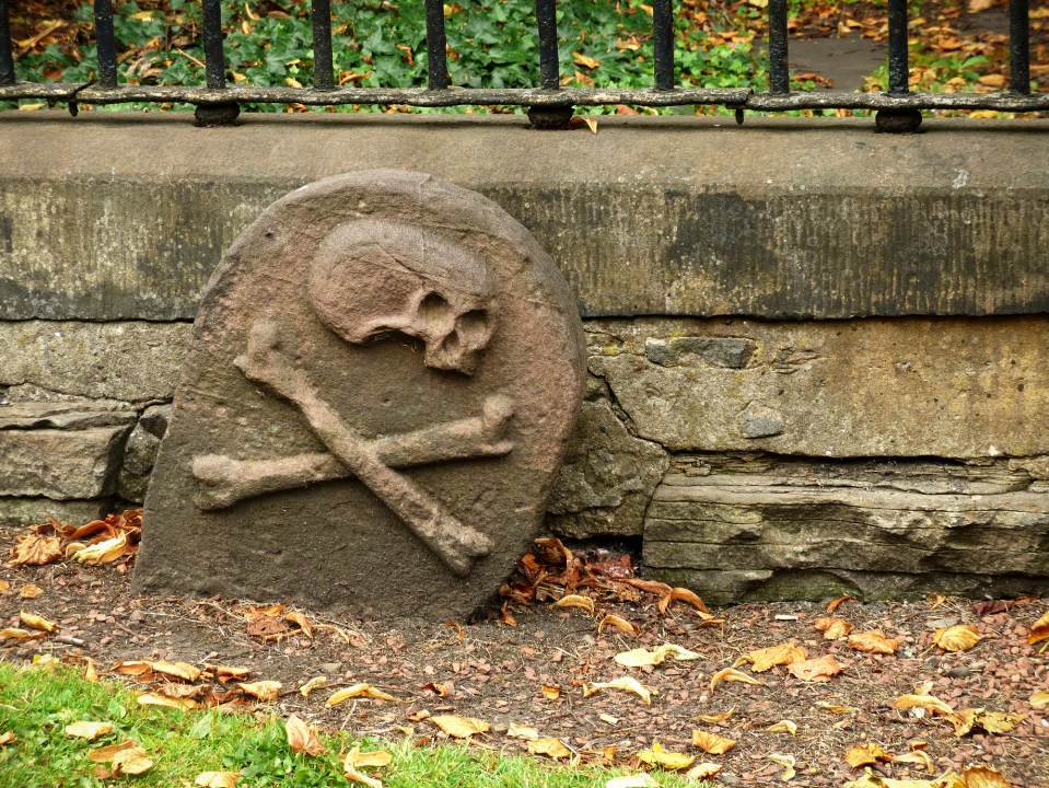 A symbol of a gravestone of someone who died of the plague