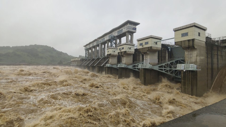 Water gushes out of the floodgates of the Gunnam Dam in Yeoncheon