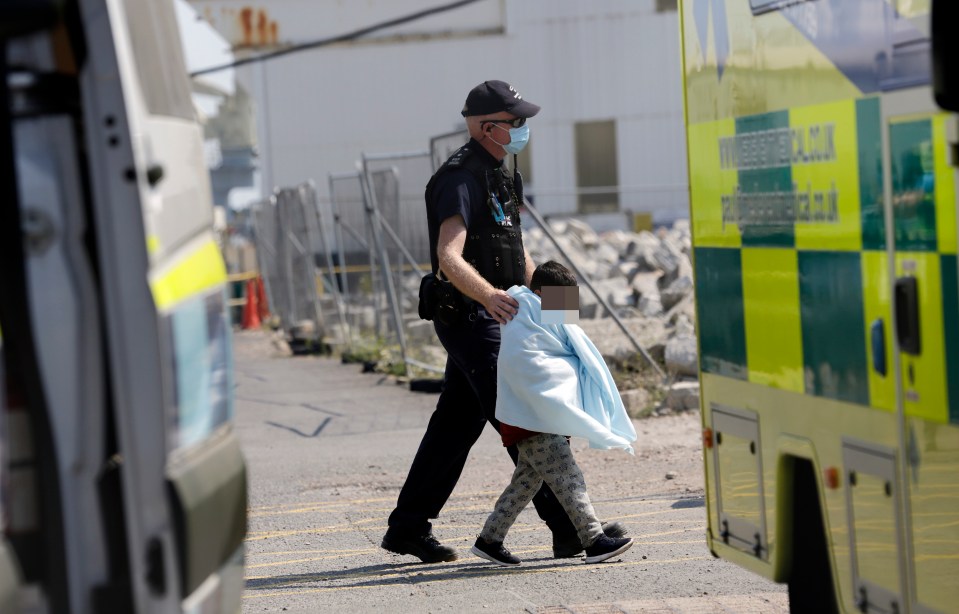 Towels were wrapped around young children who had made the dangerous crossing