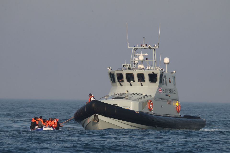  HMC Hunter tows a migrant boat crossing the English Channel