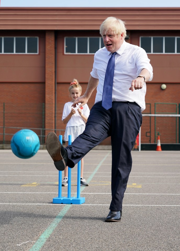 Boris Johnson has a kickabout with kids at the Premier Education Summer Camp at Sacred Heart of Mary Girl's School, Upminster