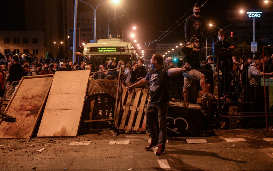 Protesters man a barricade in battles with police