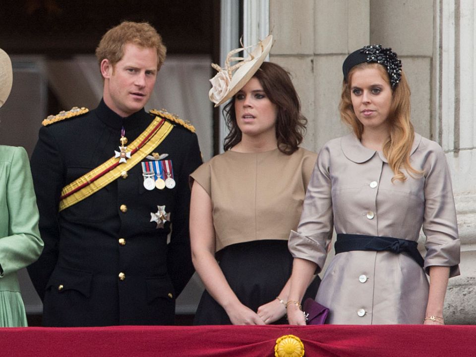 The royal can be seen chatting with the royal sisters, Beatrice and Eugenie