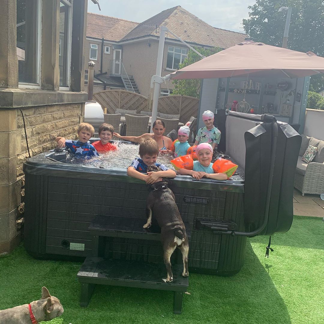 Britain's largest family the Radfords were seen unwinding in their hot tub