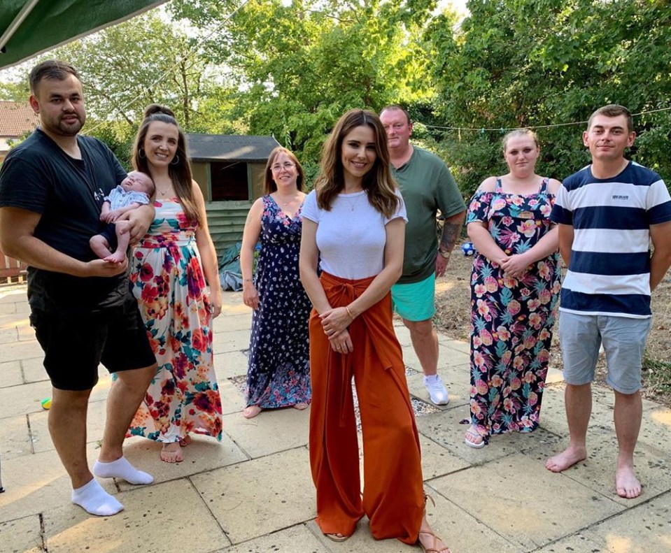 Cheryl posed with Michelle and her family as well as her newborn son