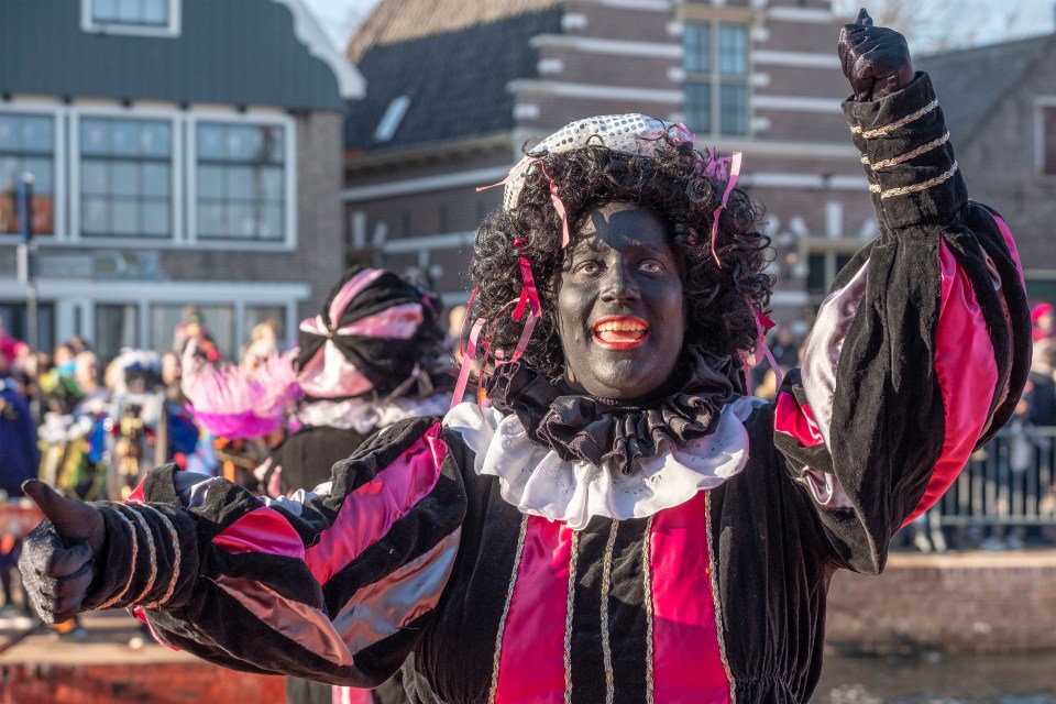 White people in the Netherlands often don blackface makeup, red lipstick and curly black wigs to play Black Pete during street parties