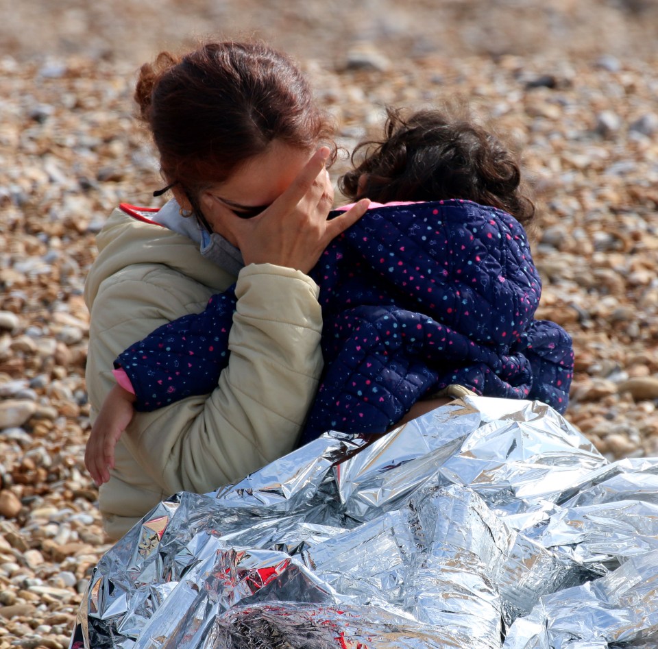 One mother recovers after making the crossing with her child