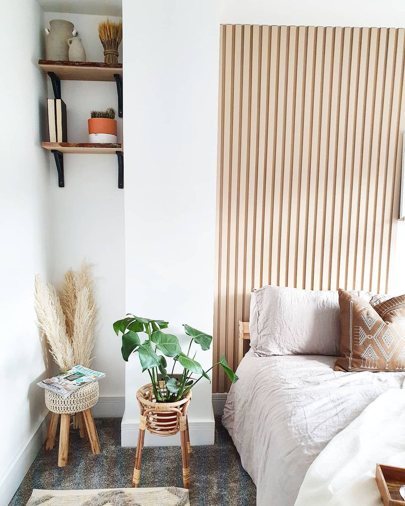 A woman has shown off timber panelling she added to her bedroom