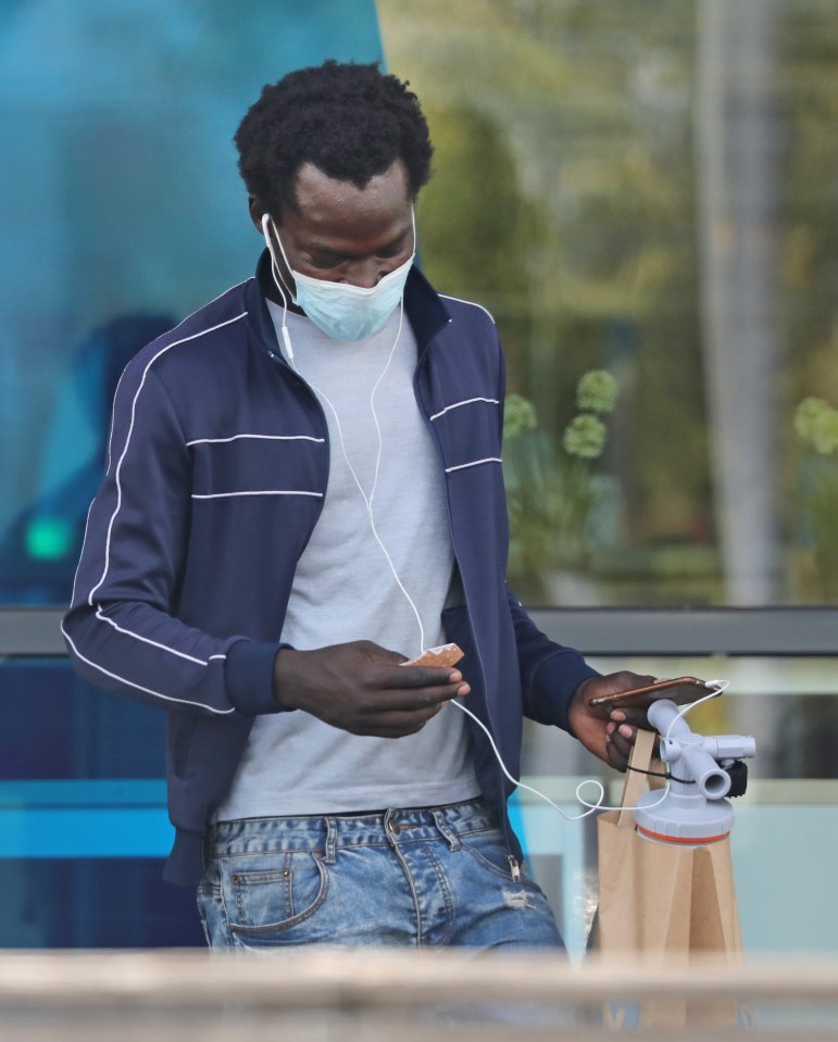 A migrant leaves a Calais superstore with a bilge pump for a dinghy