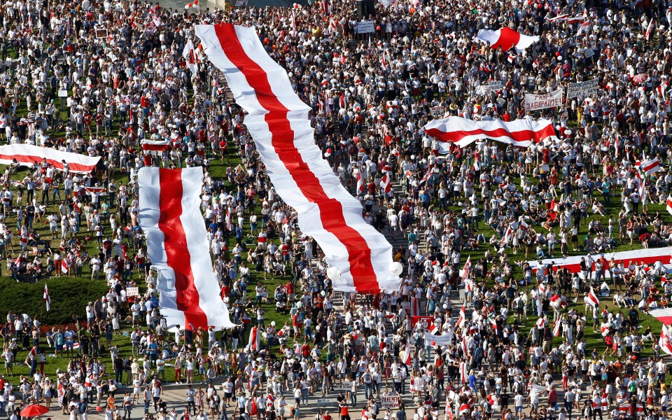 Opposition rallies have swelled in size as they unite under Belarus's former red and white flag