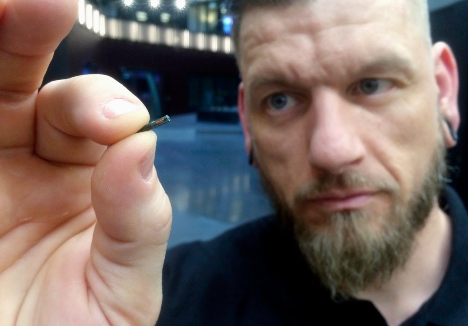  Jowan Osterlund from Biohax company in Sweden, holding a microchip like the ones implanted in 3,500 Swedes