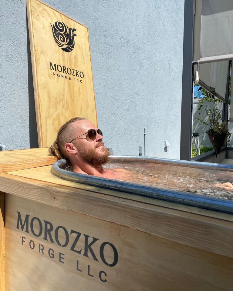 A brave man takes a chilly dip in an ice bath, similar to the one Jack Dorsey uses