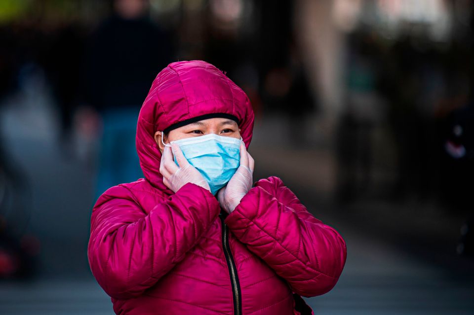 A woman wears a protective face mask in Stockholm, Sweden